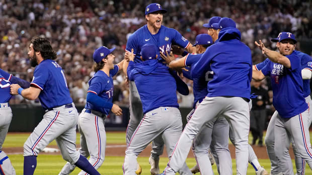 Rangers players celebrate winning the 2023 World Series.